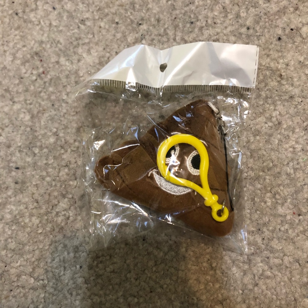 Poop emoji keychain still in packaging